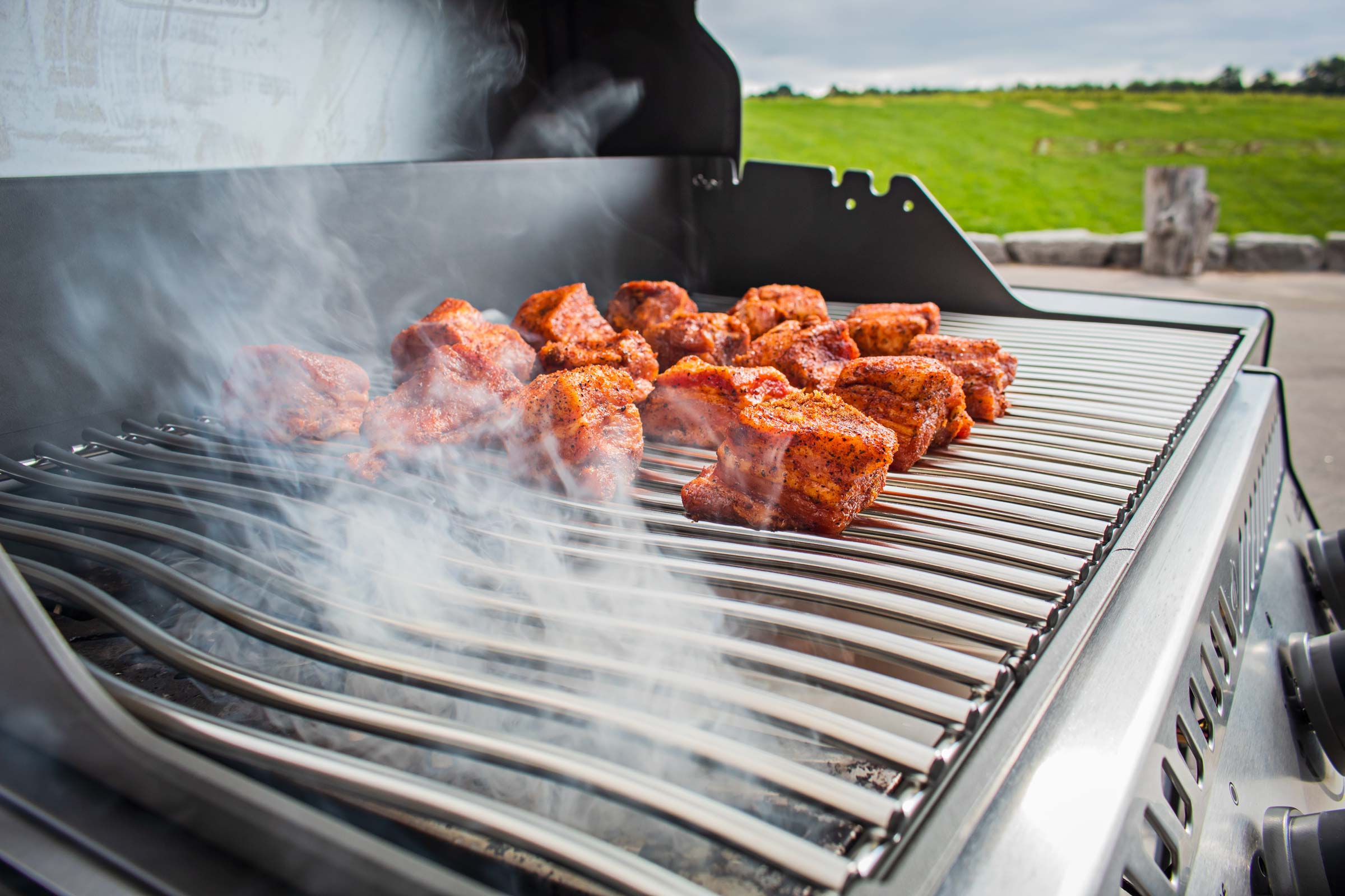 Grilling meat on smoker grill