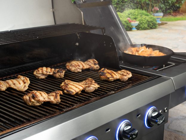 Chicken thighs on open grill